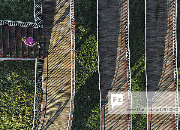 Russia  Aerial view of woman walking on boardwalk