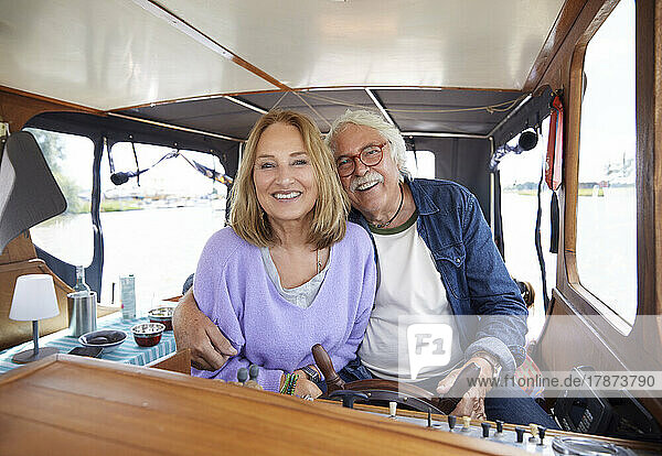 Happy senior couple enjoying in boat