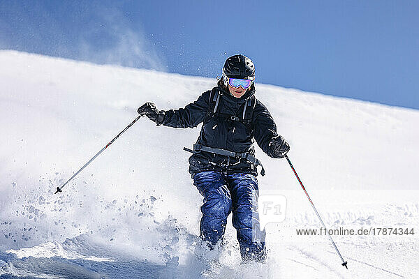 Woman sking on snowy slope