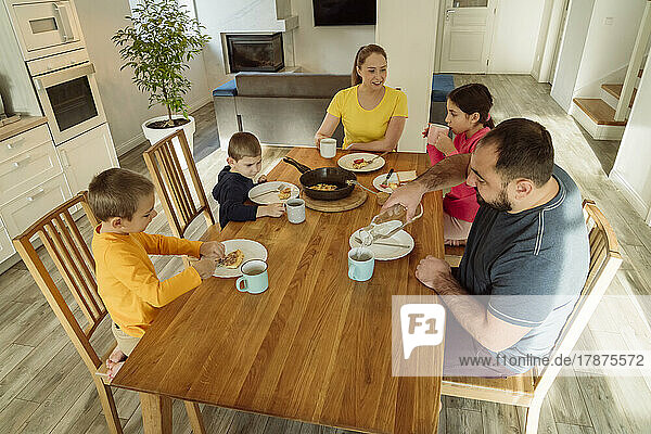 Family having breakfast at home
