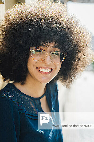 Smiling businesswoman with Afro hairstyle