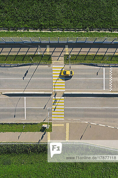 Russia  Aerial view of single car passing empty zebra crossing