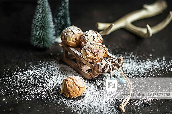 Studio shot of gluten free almond cookies on miniature sled