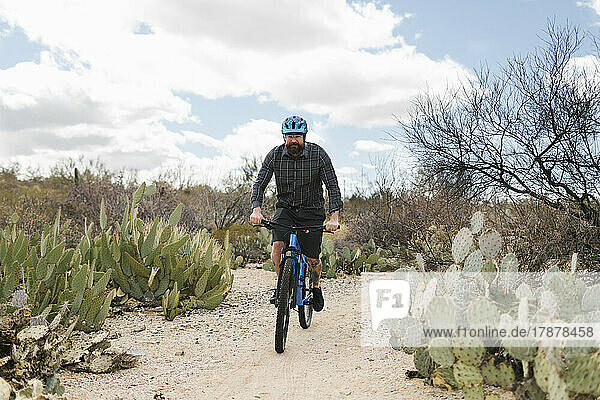 Man riding bike in desert