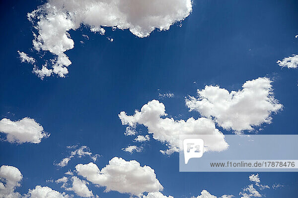 White puffy clouds on blue sky