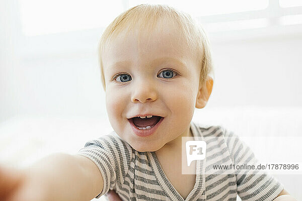 Portrait of smiling baby boy (12-17 months)
