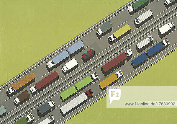 View from above trucks and cars in traffic on freeway