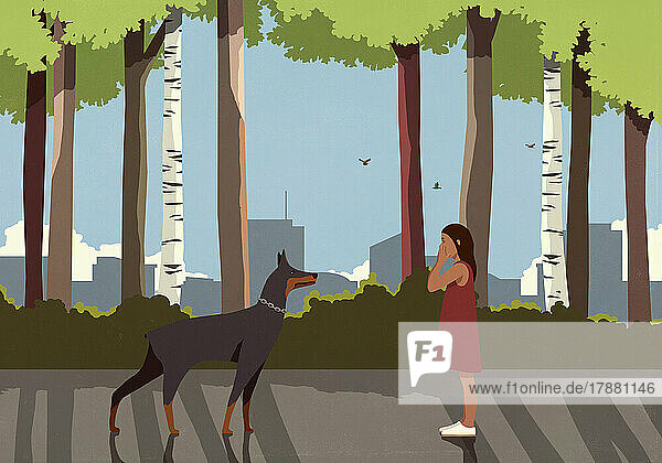 Afraid girl and Doberman Pinscher dog face to face in city park