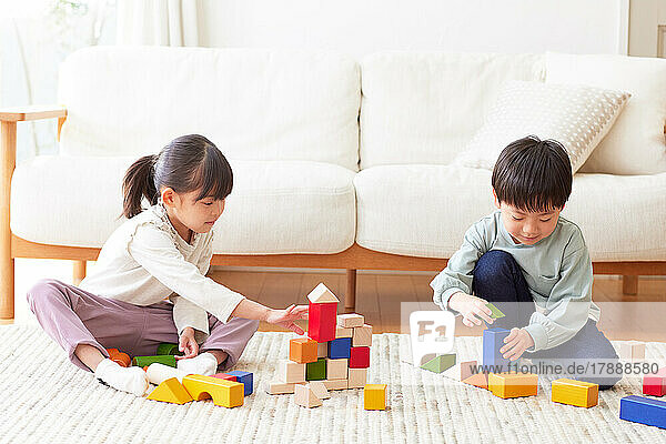 Japanese kids playing with toys at home