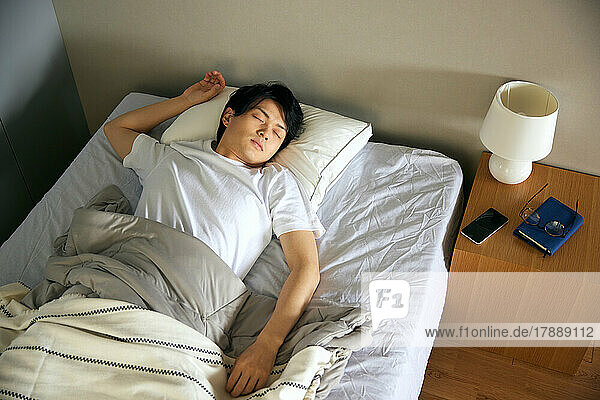 Japanese man in bed