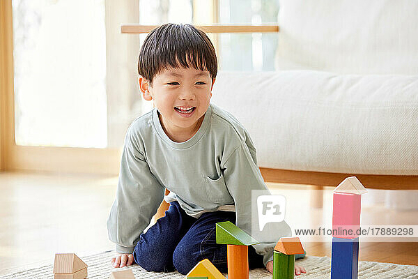 Japanese kid playing with toys at home