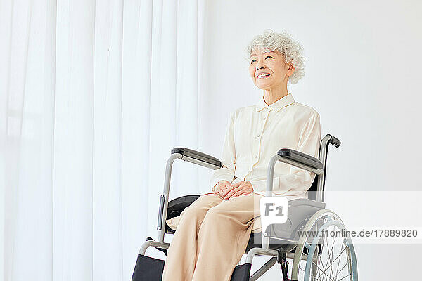 Japanese senior woman on a wheelchair
