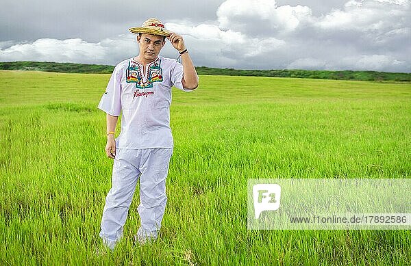 Nicaraguan man in folk costume in the field  Man wearing Central American folk costume  Young man in cultural and folk costume from Nicaragua. Concept of man in Nicaraguan folk costume