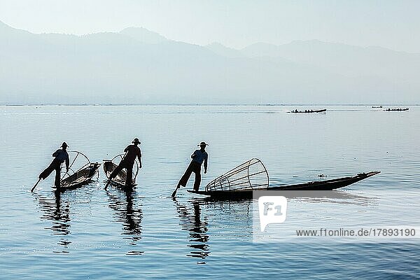 Myanmar travel attraction landmark  Traditional Burmese fisherman at Inle lake  Myanmar famous for their distinctive one legged rowing style