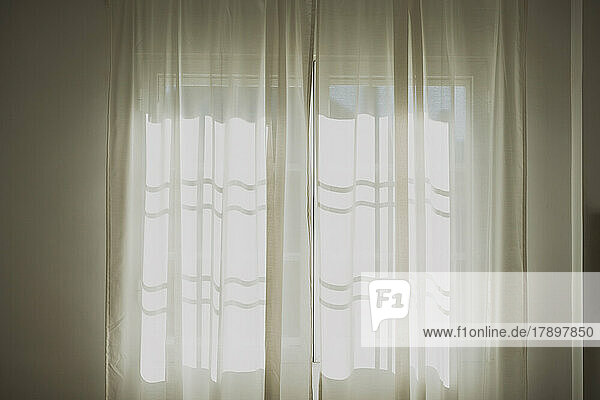 White color curtains on window at home