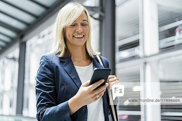 Mature businesswoman using mobile phone
