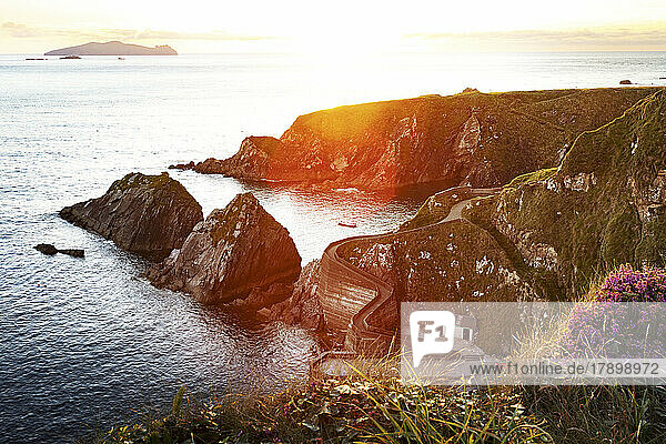 Ireland  County Kerry  View of Dunquin Harbour and surrounding cliffs at sunset
