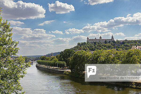 Germany  Bavaria  Wurzburg  Clouds over River Main with Marienberg Fortress in background