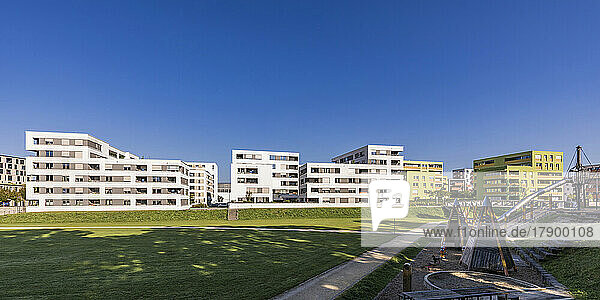 Germany  Baden-Wurttemberg  Ulm  Modern suburban apartments with public playground in foreground