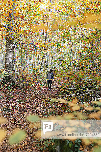 Woman standing at Fageda D'en Jorda national park  Olot  Girona  Spain