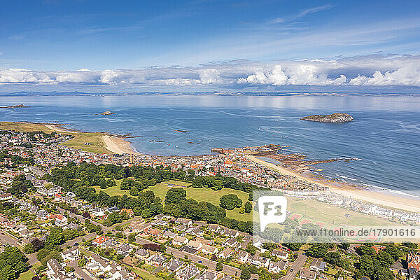 UK  Scotland  North Berwick  Aerial view of coastal town in summer with park in center