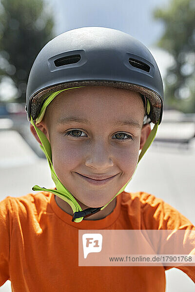 Smiling boy wearing cycling helmet