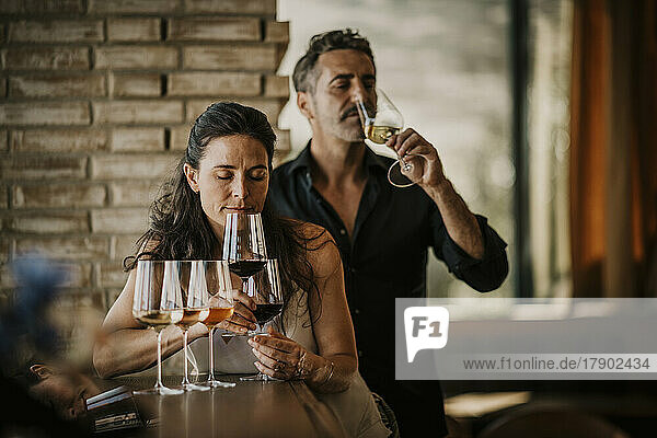 Couple doing wine tasting in restaurant