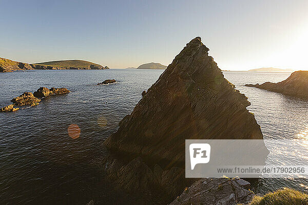 Ireland  County Kerry  View of stack rock near Dunquin Harbour at sunset