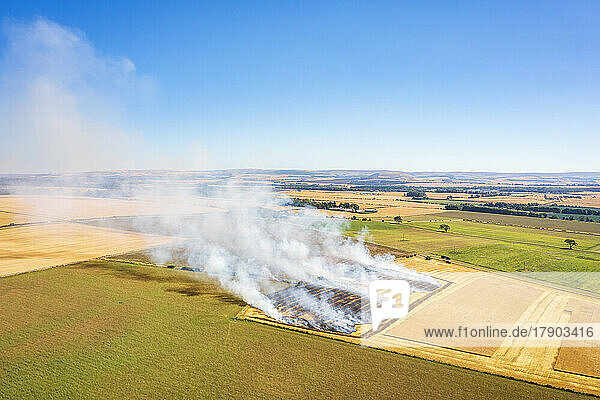 UK  Scotland  Aerial view of burning wheat field