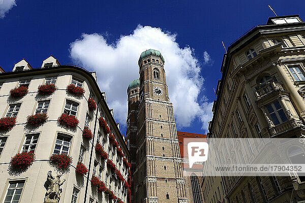 Germany  Bavaria  Munich  Apartment buildings with Cathedral of Our Lady in center