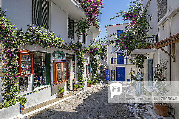 View of shops in whitewashed street in Skiathos Town  Skiathos Island  Sporades Islands  Greek Islands  Greece  Europe