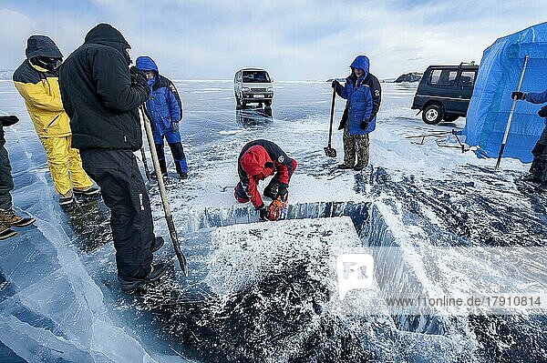 Digging a hole in ice for scuba divers  Lake Baikal  Pribaikalsky National Park  Irkutsk Province  Siberia  Russia  Europe