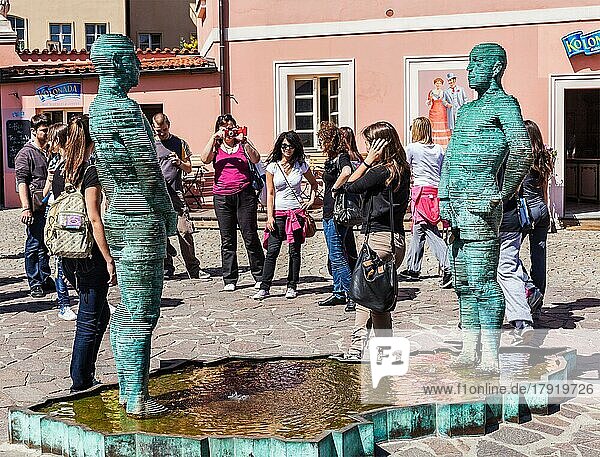 PRAGUE  CZECH REPUBLIC  APRIL 28  2012: Bizarre peeing men sculpture by David Cerny in Prague  Czech republic surrounded by tourists