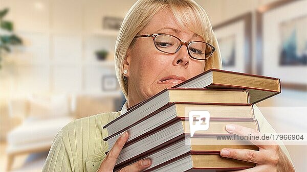 Beautiful expressive student or businesswoman with books in office