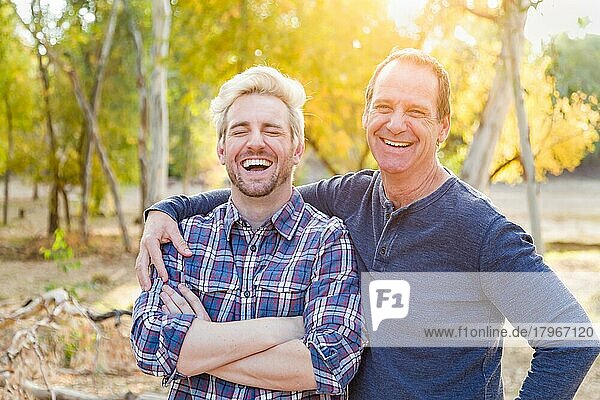 Happy caucasian father and son portrait outdoors