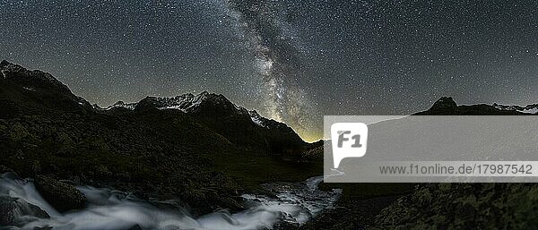 Mountain stream with Winnebachsee hut and Winnebach peaks with starry sky and Milky Way  Sellrain  Innsbruck  Tyrol  Austria  Europe