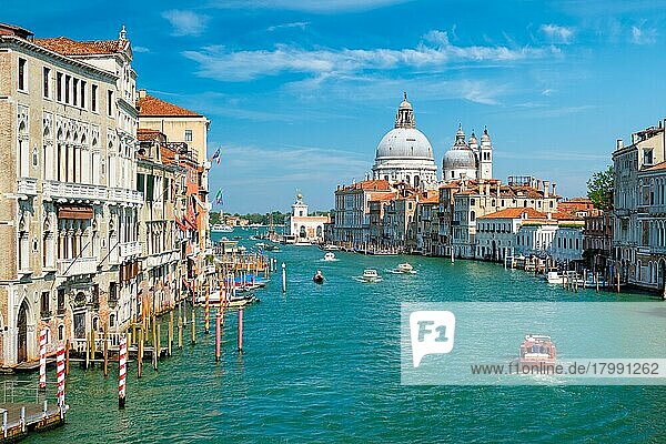 View of Venice Grand Canal with boats and Santa Maria della Salute church in the day from Ponte dell'Accademia bridge  Venice  Italy  Europe