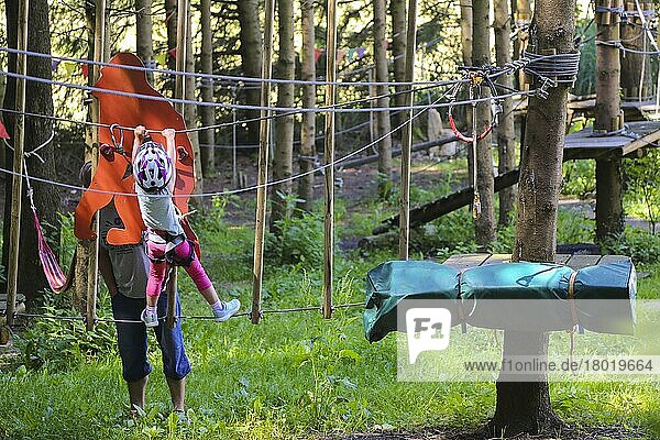 Child  girl with helmet  forest ropes course  climbing park  high ropes course  climbing  leisure  Wallenhausen- Weißenhorn  Bavaria  Germany  Europe