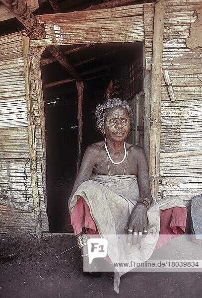 Mudunga tribal old lady sitting in front of the hut a tribal village near Silent Valley  Kerala  India  Asia