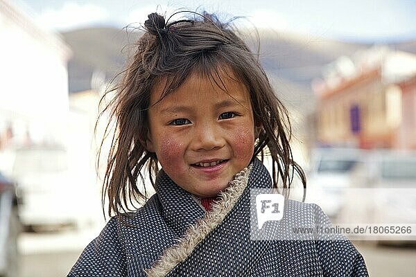 Close-up portrait of a Tibetan child in Qagca village  Cacagoin  Sichuan province  China  Asia