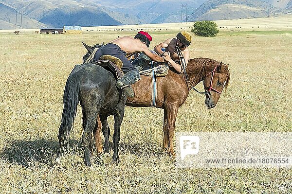 Atpen Audaraspak  Traditional Kazakh Arm Wrestling on Horseback  Gabagly National Park  Shymkent  South Region  Kazakhstan  Central Asia  For editorial use only  Asia