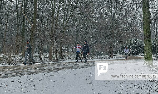 Berlin 03. 01. 2021: Walk winterly  jogger  snow  Großer Tiergarten  park  Berlin  Germany  Europe