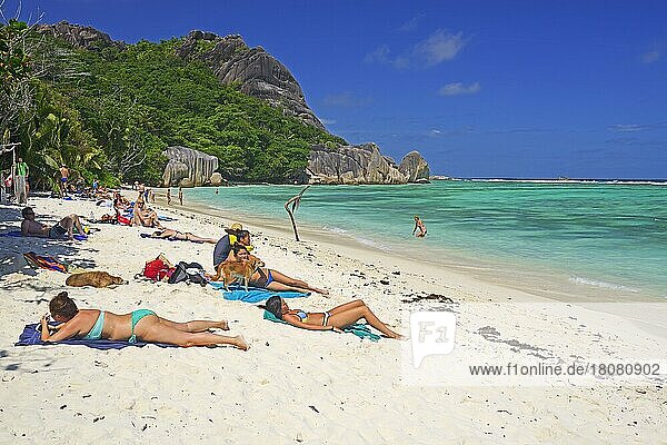 Bathers sunbathe on the dream beach Source d'Argent  La Digue Island  Seychelles  Africa