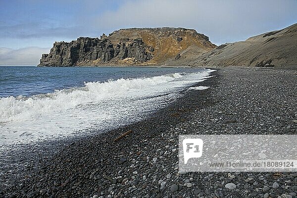 Black volcanic beach on Jan Mayen  volcanic island in the Arctic Ocean