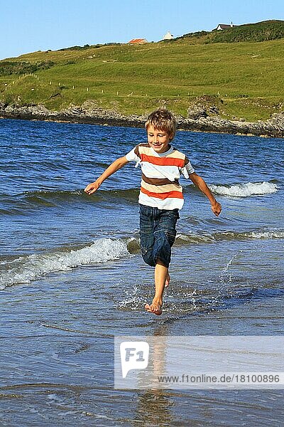 Boy on the beach  Sutherland  Scotland  Great Britain