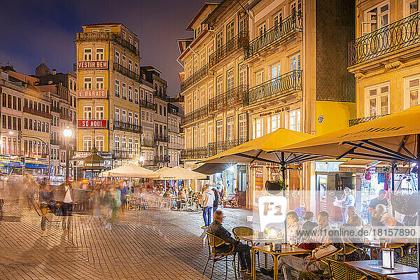 View of cafes in Praca de Almeida Garrett at night  Porto  Norte  Portugal  Europe