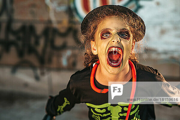 teen girl in zombie costume at halloween party