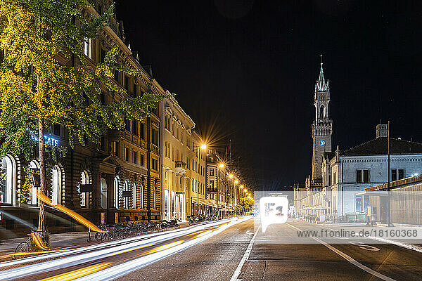 Germany  Baden-Wurttemberg  Konstanz  Vehicle light trails stretching along city street at night