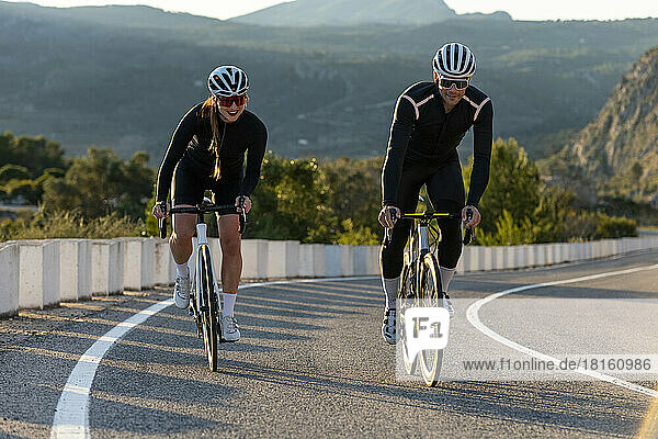 Cyclists cycling with each other on Costa Blanca mountain pass in Alicante  Spain