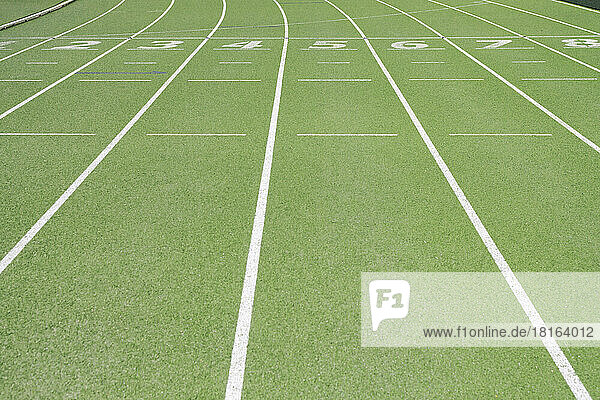 Numbers on running track at sports field